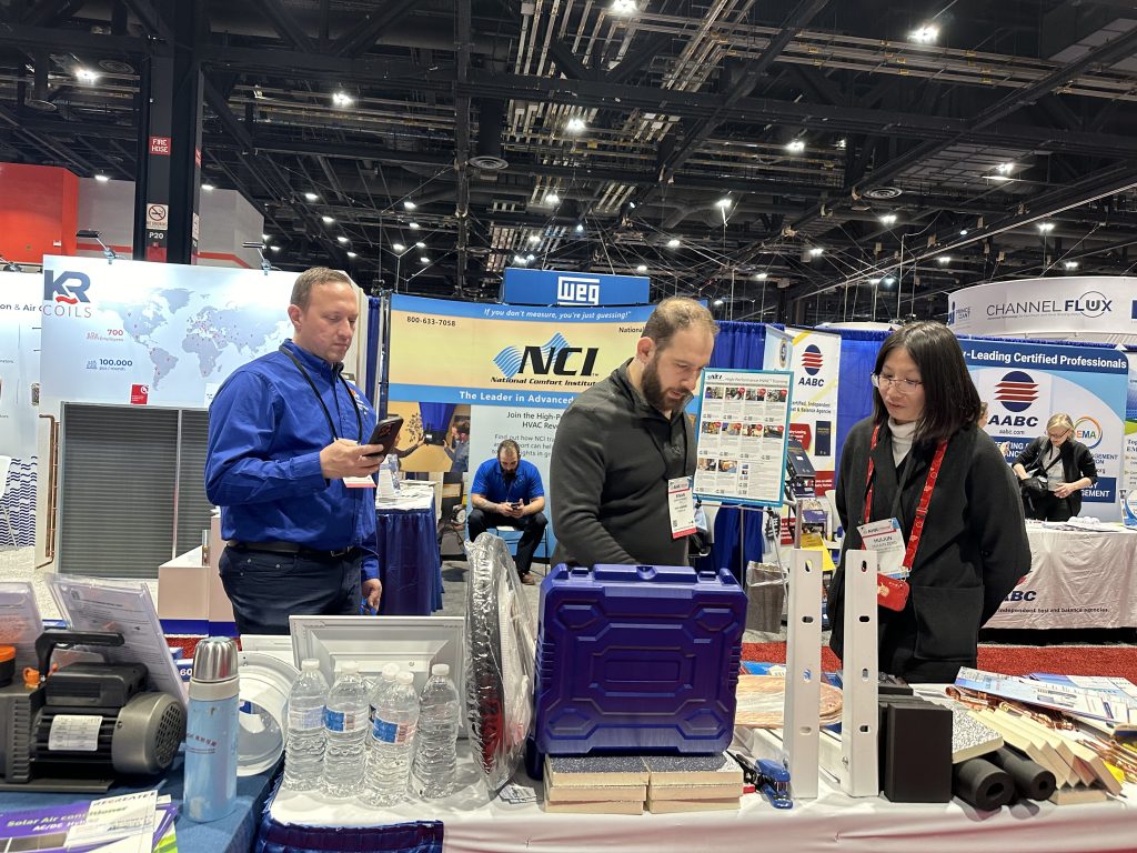 Engaging discussions with HVAC professionals at AHR Expo.