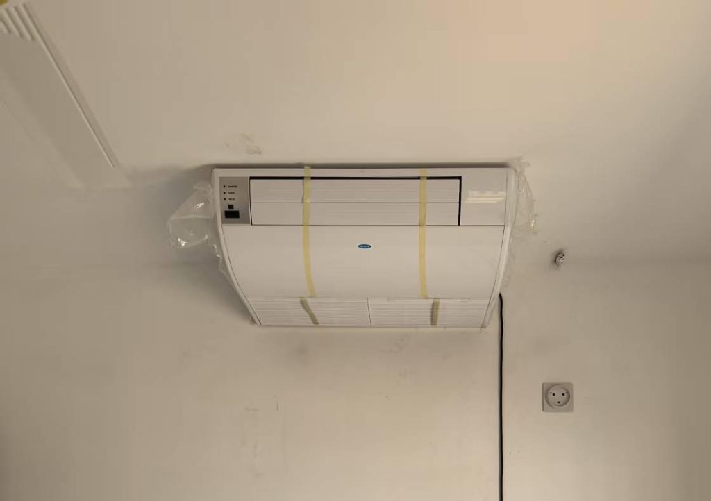 Shows the installation process of indoor units within the Djibouti commercial building, focusing on the integration of NEWEX HVAC solutions into the office spaces.